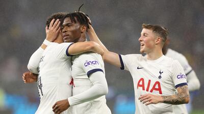 Tottenham's Destiny Udogie, centre, celebrates after scoring. Getty