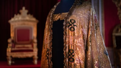 The historic coronation vestments have intricate gold embroidery