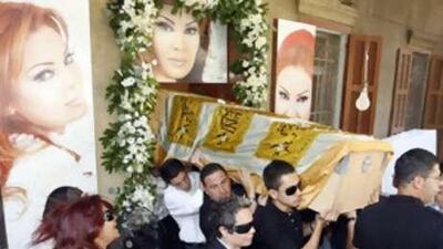 Relatives of murdered Lebanese singer Suzan Tamim carry her coffin during her funeral in Beirut on Aug 4.