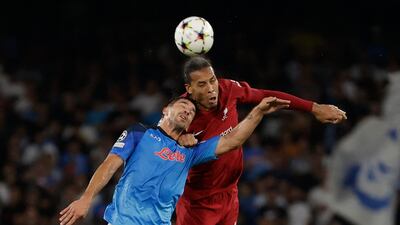Liverpool's Virgil van Dijk takes on Napoli's Giovanni Simeone in the Champions League. Reuters