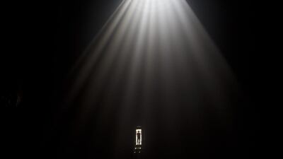 A man stands in the door of the church roof inside the Church of the Holy Sepulchre in Jerusalem during the Holy Fire ceremony on 19 Arpil 2014, the day before Easter. Eastern Orthodox Christians believe the Holy Fire, which emenates from within the Tomb of Christ and quickly spreads around the church and outside to Jerusalem and even to foreign countries, represents the flame of the Resurrection power, as well as the fire of the Burning Bush of Mount Sinai. Abir Sultan / EPA