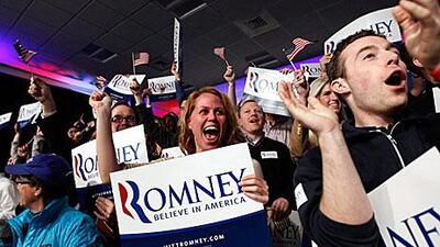Supporters of Mitt Romney, the Republican presidential election candidate, celebrate after he wins the New Hampshire primary yesterday.