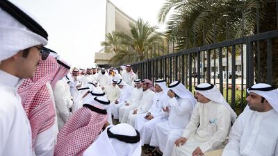 Kuwaiti parliament members and supporters gather in front of the Kuwait National Assembly building. EPA