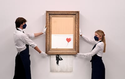 Banksy famously shredded his own artwork at a Sotheby's auction in 2018. EPA