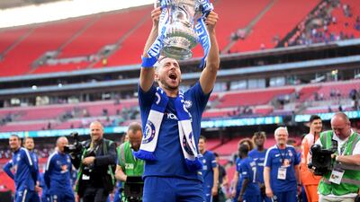Eden Hazard holds aloft the FA Cup as his penalty secured a 1-0 win for Chelsea over Manchester United in the final at Wembley. Laurence Griffiths/Getty Images