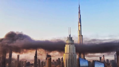 The smoke snakes across the sky over the Downtown area of Dubai. Courtesy Nikolett Scholtz