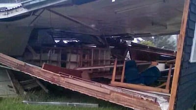 A house sits collapsed following a 7.5 earthquake struck Papua New Guinea. Jerol Wepii / AP