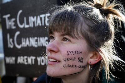 A student takes part in a protest against climate change in Switzerland. Fabrice Coffrini / AFP