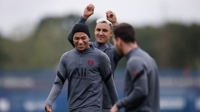 Kylian Mbappe with Keylor Navas, back, and Lionel Messi, right. EPA