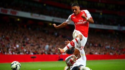Alex Oxlade-Chamberlain pushed hard for victory once he had equalised for Arsenal on Saturday night. Paul Gilham / Getty Images