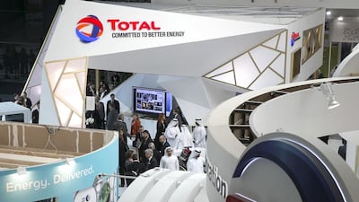 Visitors mingle near the Total stall at the Abu Dhabi International Petroleum Exhibition & Conference in November, 2014, at the Abu Dhabi National Exhibition Centre. Silvia Razgova / The National