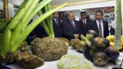 Talmiz Ahmad, second from left, India's Ambassador to the UAE, admires the festival's food offerings.
