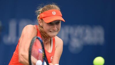 Ekaterina Makarova plays a backhand to Dominika Cibulkova on Tuesday at the Dubai Duty Free Tennis Championship at the Dubai Tennis Stadium. Tom Dulat / Getty Images