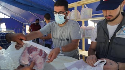 Volunteers with the Nabatieh First Aid charity distribute meat for Eid Al Adha in the southern Lebanese city. Sunniva Rose / The National