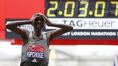 Kenya's Eliud Kipchoge reacts after crossing the finish line to win the elite men's race of the 2016 London Marathon in central London on April 24, 2016. Justin Tallis / AFP