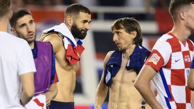 Croatia midfielder Luka Modric speaks with France forward Karim Benzema after the match. AFP