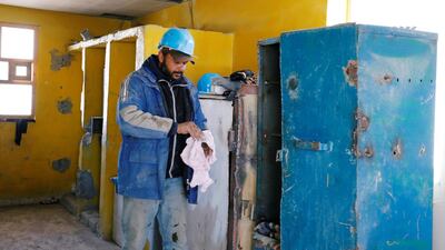 A worker at a phosphate production plant at the end of his shift in Metlaoui, Tunisia. Reuters