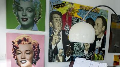 The grand piano, beneath multicoloured pop-art prints, at Judith Hobby's family home. Reem Mohammed / The National