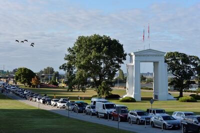 Travellers line up to enter Canada from the US. Reuters