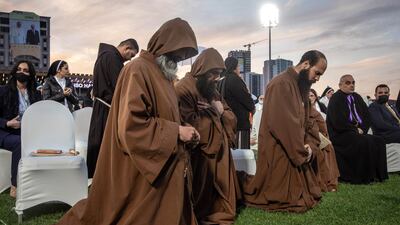Monks pray during a mass conducted by Pope Francis at the Franso Hariri Stadium. Getty Images