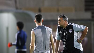 Cosmin Olaroiu, right, and Mirel Radoi, back to camera, worked together at Al Ain and will team up again at Al Ahli this coming season. Mike Young / The National