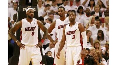 After an uneven regular season where they did not completely dominate, to not win a championship would be a total letdown for LeBron James, left, Chris Bosh, centre, and Dwyane Wade.