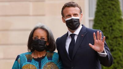France's President Emmanuel Macron welcomes Ethiopia's President Sahle-Work Zewde upon her arrival for a dinner at the Elysee Presidential Palace in Paris. AFP