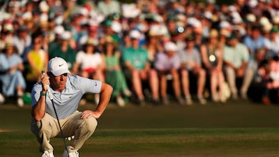 Rory McIlroy of Northern Ireland lines up a putt on the 18th green during the final round of the 2026 Masters. Getty Images