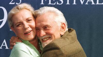 This September 7, 1999 file photo shows Lauren Bacall and Kirk Douglas posing for the photographers prior to their press conference during the 25th American Film Festival in Deauville, France, where they presented their latest film Diamonds.