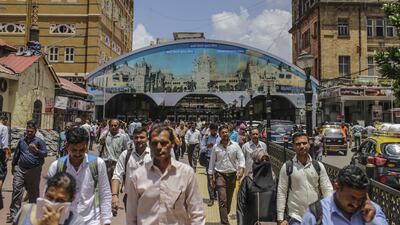 Commuters exit Masjid Bunder train station in Mumbai, India. India's unemployment rate hit a three-year high of 8.4 per cent in August, according to think tank Centre for Monitoring Indian Economy. Bloomberg