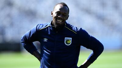 Usain Bolt smiles during a break in the session. EPA