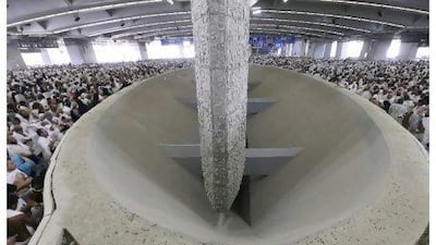 Pilgrims cast stones at the pillar in the rajem ritual. Those crushed had been going to Muzdalefa by metro to collect stones.