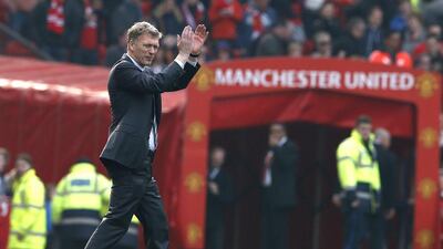Manchester United manager David Moyes applauds the fans at Old Trafford after his team's English Premier League defeat of Aston Villa on March 29, 2014. Phil Noble / Reuters