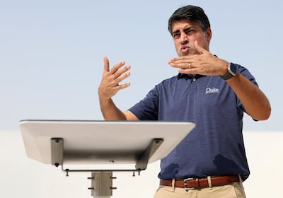 Jimmy Grewal, managing director of Dubai-based Elcome, showing a Starlink antenna. Chris Whiteoak / The National