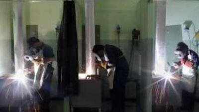 Students learn skills at the welding and fitting workshop at the Vocational Education Development Centre in Al Shamka.