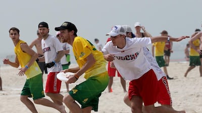 Australia (Green) and Russia (White) in action during the 2015 World Championships of Beach Ultimate (WCBU) at the JBR beach in Dubai. Satish Kumar / The National