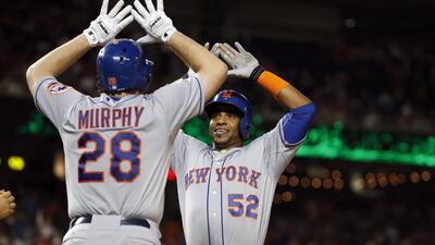 Daniel Murphy, Yoenis Cespedes (52) and the rest of the New York Mets have been celebrating a lot of late. AP Photo / Alex Brandon