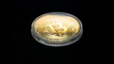 A Bitcoin coin is displayed at the SecuX booth at the Consumer Electronics Show in Las Vegas earlier this week. The launch of a new Bitcoin options contract on the Chicago Mercantile Exchange on Monday has already attracted interest from institutional investors, according to JP Morgan Chase. EPA