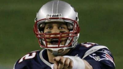 New England Patriots quarterback Tom Brady (12) directs a play in the fourth quarter during the Super Bowl XLII football game against the New York Giants at University of Phoenix Stadium on Sunday, Feb. 3, 2008 in Glendale, Ariz. (