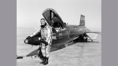 Pilot Neil Armstrong next to the X-15 ship after a research flight. The X-15 was a rocket-powered aircraft that set the world's unofficial speed and altitude records