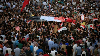 People gather during a protest in the city of Najaf, Iraq. Reuters