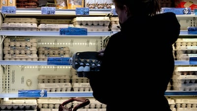 A woman shops for eggs at a grocery store in Washington. AFP