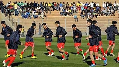 North Korea's players warm up at Makhulong stadium in Johannesburg before their international friendly against Nigeria.