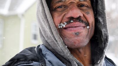 Ice forms on Erick Harrison's moustache as he shovels a pavement during a winter storm, in Sioux Falls, South Dakota, US. AP