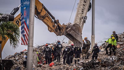 Search and rescue teams look for possible survivors in the rubble of the partially collapsed 12-storey Champlain Towers South building in Surfside, Florida. AFP