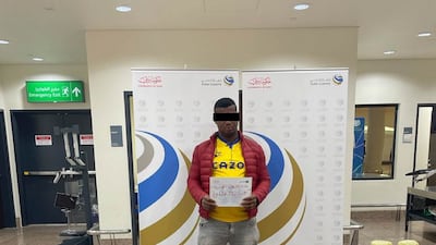 The suspect held at Dubai International Airport, with the 37kg of marijuana discovered by Customs officers in his luggage. Photo: Dubai Customs