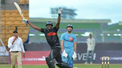 Usain Bolt celebrates after his team beats Yuvraj Singh's in the four-over exhibition cricket match on Tuesday in Bangalore. Manjunath Kiran / AFP