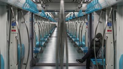 A man wearing a face mask rides in a empty subway in Istanbul. EPA