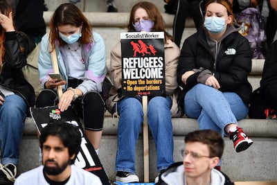 A protester holds a sign reading "Refugees Welcome" during a demonstration on the sidelines of the annual Conservative Party Conference in Manchester, north-west England, on October 3. AFP