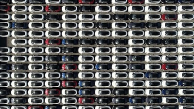 An aerial view shows imported cars, including Tesla electric vehicles, parked at Taipei Port. AFP